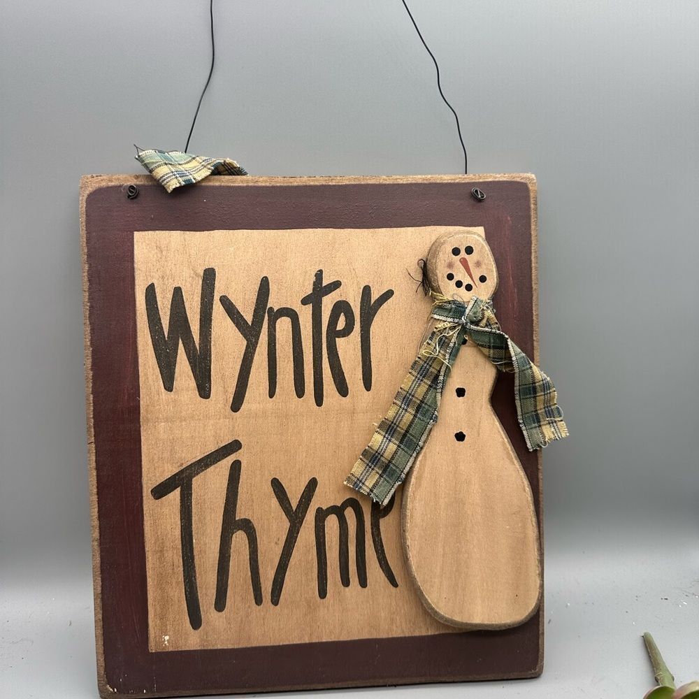 Primitive wooden snowman sign